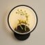 A deer-themed wall lamp featuring LED wall sconce lights with a detailed deer motif on a round, wall-mounted base