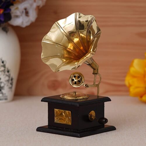 Vintage-style brass gramophone showpiece with a large horn on a golden iron stand, positioned on a dark wooden base.